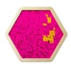 Close-up of a pink sequin surface inside a pale gold hexagonal frame, with a small cluster of yellow sequins forming a pattern.