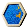 Blue hexagonal mosaic panel with shimmering sequins inside a pale wooden frame, featuring small yellow patches.