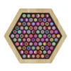 Hexagonal wooden frame with a black pegboard densely filled with multicolored circular pegs.