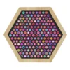 Hexagonal wooden pegboard filled with dozens of colorful circular pegs on a black background, arranged in a grid pattern.