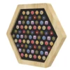 Wooden hexagonal game board with a black playing surface filled with colorful circular and square tokens.