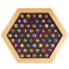 Wooden hexagonal marble board filled with dozens of colorful marbles in holes by colorful game surface.